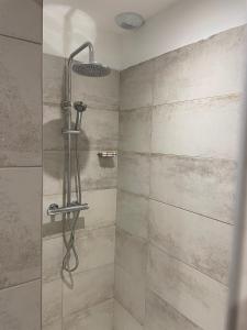 a shower with a glass door in a bathroom at Lortu vivu in Castifao