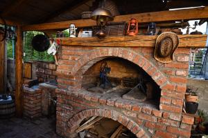 a brick oven in a house with aperature at Etno kuca Drina in Loznica