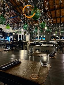 a table in a restaurant with glasses on it at Vicolo delle Belle Suite in Terracina