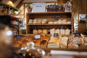 a bakery with lots of different types of bread at The Three Daggers in Edington +16 photos