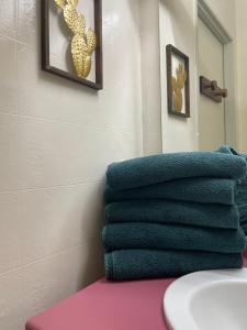 a pile of towels sitting on a counter in a bathroom at Appartement en bord de lac in Malbuisson +35 photos