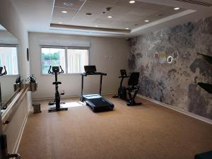 an empty room with a gym with exercise equipment at DOMITYS - L'Edito in Amiens