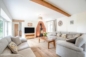 a living room with two couches and a tv at 4 Bed in Taunton oc-w35167 in West Monkton