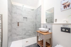 a bathroom with a sink and a shower at 4 Bed in Taunton oc-w35167 in West Monkton +35 photos
