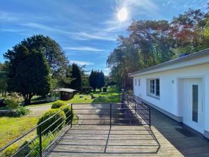 a stairway leading to a building with the sun in the sky at Ferienhaus Hete in Staphel