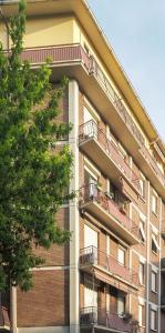an apartment building with balconies on the side of it at Antonio Rooms 2 in Parma