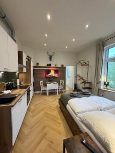 a kitchen with a large bed in a room at Villa Manninga in Krummhörn