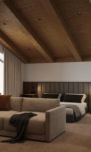 a living room with a couch and a bed at Lake Charvak Resort in Burchmulla