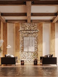 a lobby with two couches and a stone wall at Lake Charvak Resort in Burchmulla