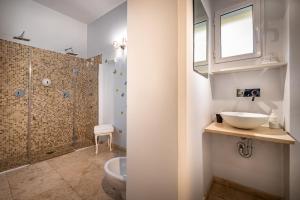 a bathroom with a sink and a toilet and a shower at Boutique Hotel La Casa di Morfeo in Florence
