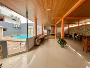 a swimming pool in the middle of a house at Hotel Cima Real in Arauca