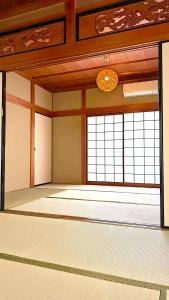 an empty room with a large room with windows at 平城空間 - Heijo Space in Nara +15 photos