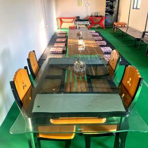 a long table with chairs and a long table at Stone Rose Vista in Kanatal +14 photos