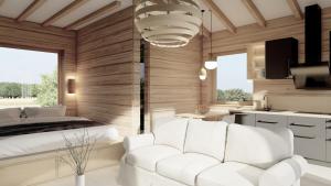a bedroom with a white couch and a bed at Sky Chalets Bühlertal in Bühlertann +22 photos