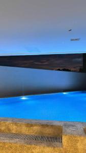 a television screen with a picture of blue water at Cityscape Grand Tower Cebu - 2 Bedrooms with Balcony Close to Ayala Mall - New Condo in Cebu City
