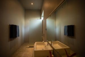 a bathroom with a sink and a mirror at Sudu Appu Villa Beruwala in Beruwala +32 photos