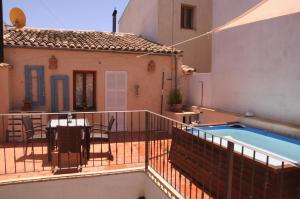 a balcony of a house with a swimming pool at Ca nostra in Artá