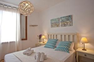 a bedroom with a bed with towels on it at Ca nostra in Artá +35 photos