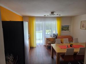 a living room with a table and a dining room at Pension Eva in Domažlice