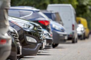 a row of cars parked on the side of a road at Kaya Residence Hotel in Bad Kreuznach