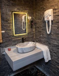 a bathroom with a sink and a mirror at Cairo Center in Cairo