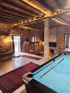 a room with a pool table in a building at Beit el loz in Ghazīr