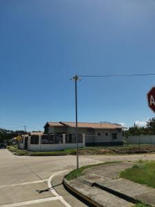 an empty street with a stop sign in front of a building at Casita del Valle in San Cristóbal