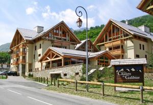 a large building with a street light in front of it at A27 Chalet du Galibier in Valloire