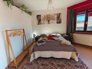 a bedroom with a large bed in a room at Monolocale moderno in centro storico in Scano Montiferro