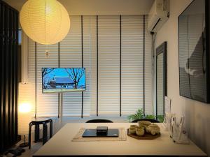 a room with a table and a large window at Seongsu#3beds#10min seongsu station#2min walk from yongdap station line2 #local food hot spot#DDP#KSPO in Seoul