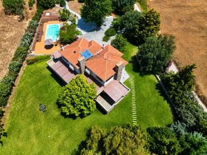 an aerial view of a house with a swimming pool at Villa Polyxeni Lavender 150m from the sea in Politika +102 photos