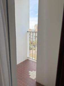 an open door to a balcony with a view at Smart Rooms Miramare in Sottomarina
