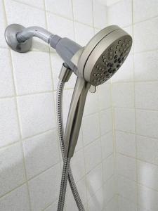 a blow dryer in a shower in a bathroom at Bright & Spacious 1BR - UoM Area in Memphis +11 photos