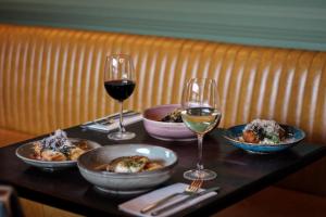 a table with glasses of wine and food on it at Kilkenny Pembroke Hotel in Kilkenny