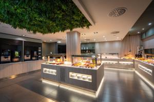 a restaurant with a lot of food on display at Turia Granada in Granada
