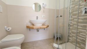 a bathroom with a sink and a shower at Il Marchesino B&B in Pizzo +9 photos
