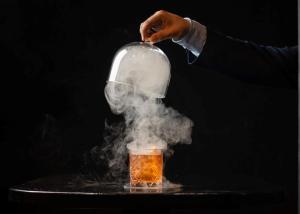 a person holding a jar with smoke coming out of it at Kilkenny Pembroke Hotel in Kilkenny +46 photos