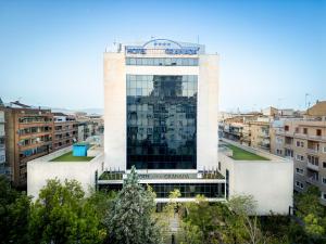 a building with a sign on top of it at Turia Granada in Granada