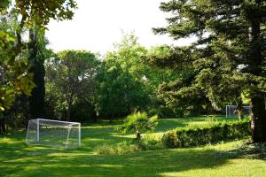 a field with a soccer goal in the grass at Mas Joanmiquel - Masía histórica exclusiva in Les Olives
