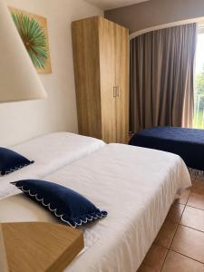 a hotel room with two beds and a window at Hotel Alata in Alata +16 photos
