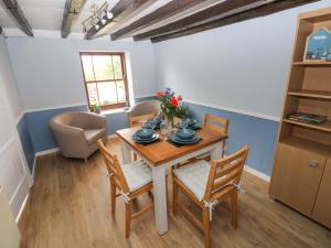 a dining room with a table and chairs at Beacon House in Haverfordwest
