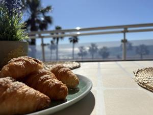 a plate of pastries sitting on top of a table at Alpen1 Pompeya in Peniscola