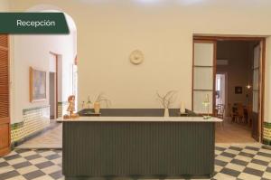 a kitchen with a green island in a room at Casa Lahusen in Colonia del Sacramento +60 photos