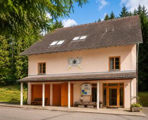 a large white building with a roof at JUFA Hotel Schloss Röthelstein in Admont