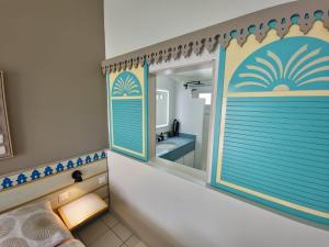 a bathroom with a large mirror and a tub at Marina View in Les Trois-Îlets +24 photos