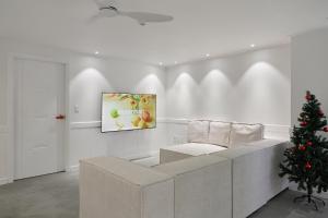 a living room with a couch and a christmas tree at soul stay 2 in Busan