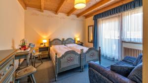 Postel nebo postele na pokoji v ubytování Hotel Brunella