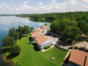 an aerial view of a house on the shore of a lake at Crown Lake Resort in Horseshoe Bend