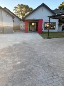 an empty parking lot in front of a building at Unit 7-9 at Homely Escapes in Phalaborwa