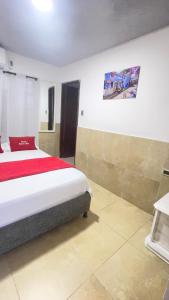 a bedroom with a large bed in a room at posada barrios mar in Cartagena de Indias